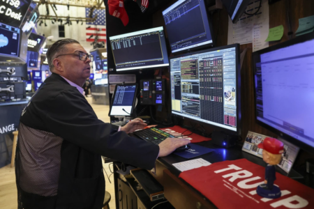 A trader works on the floor of the New York Stock Exchange on Friday.